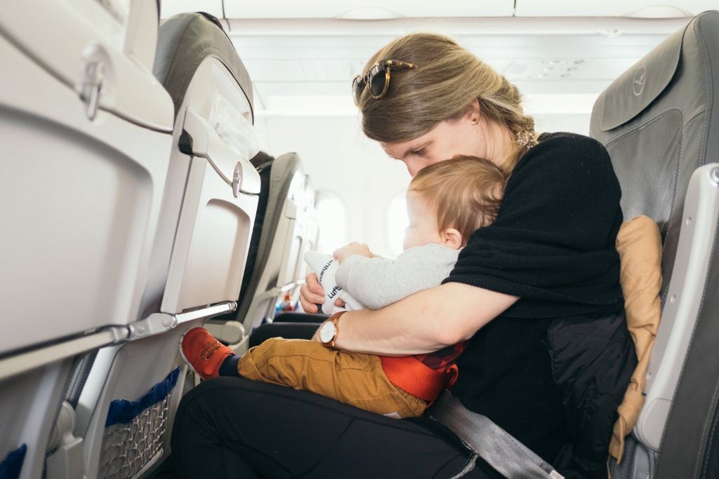 How can I protect my baby's ears while on a plane?