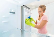 How do you clean a refrigerator efficiently