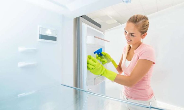 How do you clean a refrigerator efficiently