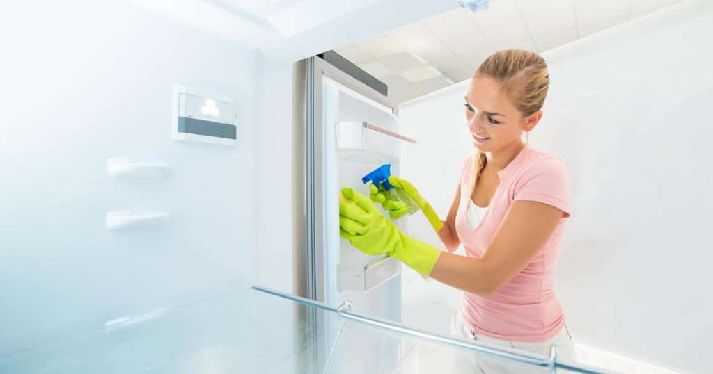 How do you clean a refrigerator efficiently