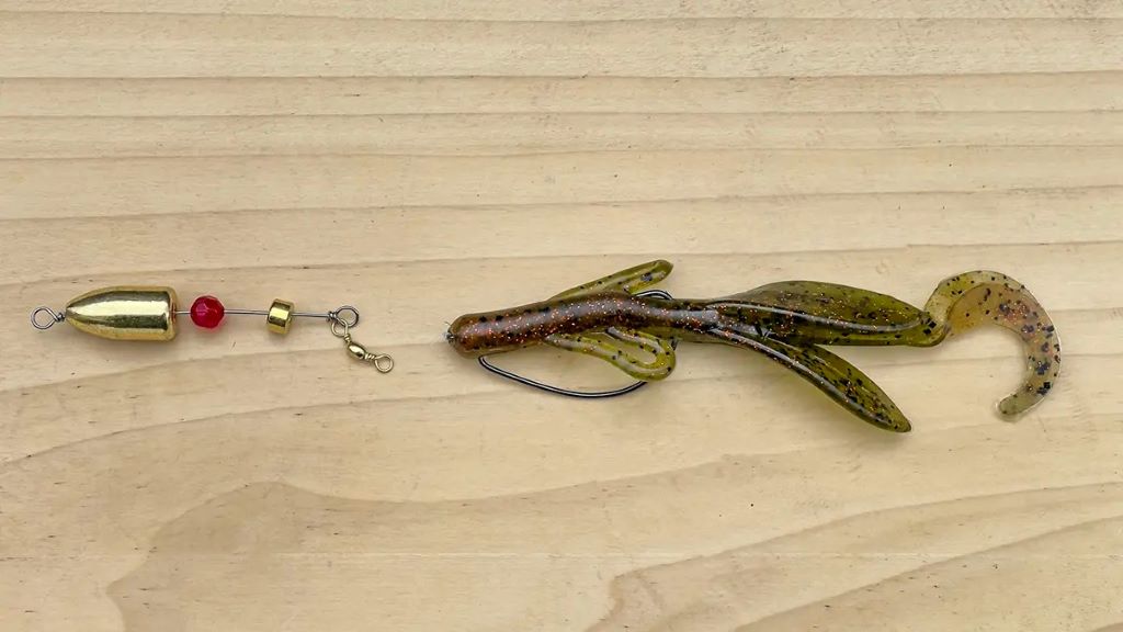 Carolina rig setup with egg sinker weight, bead, swivel, and soft plastic bait on fishing line
