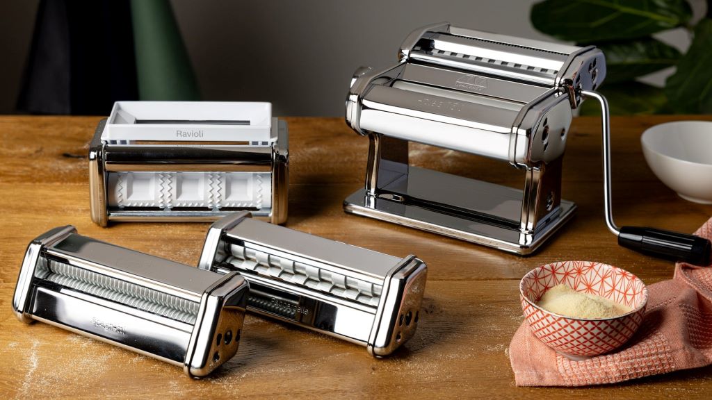 Close-up of fresh ravioli being cut with Marcato cutter attachment.