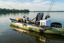 sit-on-top fishing kayak with rod holders and storage tankwell