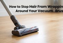 Featured image showing a vacuum head with the title: How to Stop Hair From Wrapping Around Your Vacuum Brush.