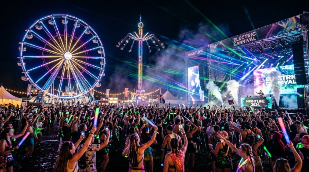 Festival mainstage with lasers and pyrotechnics at Tinker Field