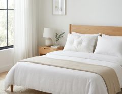 Two pillows with different firmness levels displayed on a neatly made bed