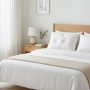 Two pillows with different firmness levels displayed on a neatly made bed