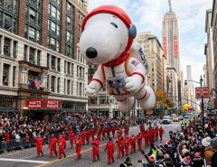Massive helium balloon floating above crowds at the Macy's Thanksgiving Day Parade in New York City