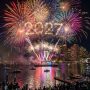 Colorful midnight fireworks exploding over Boston Harbor during First Night Boston 2027 on New Year's Eve
